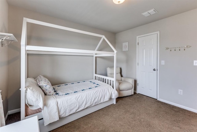 bedroom featuring carpet flooring and baseboards