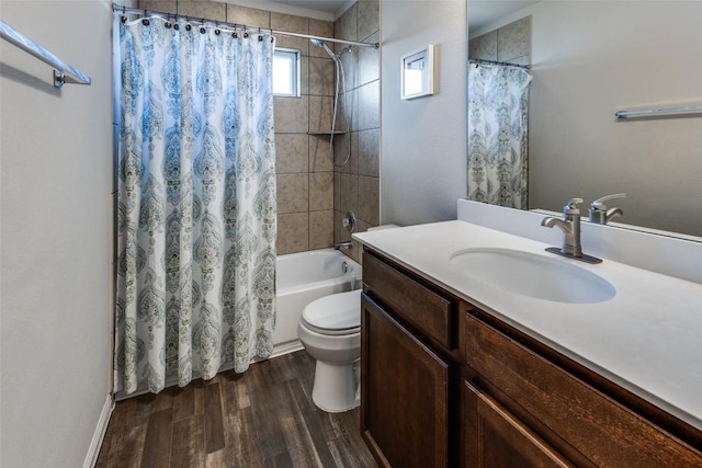 bathroom with wood finished floors, toilet, shower / bath combo, and vanity