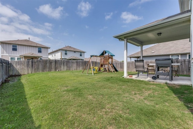 view of yard featuring a patio area and a playground