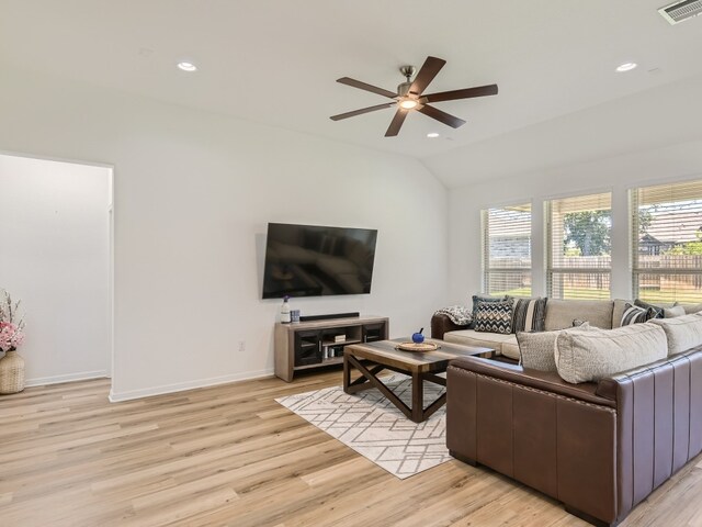 4325 Arques Ave, Round Rock, TX 78681 - living room featuring plenty of natural light, lofted ceiling, ceiling fan, baseboards, and light wood-style flooring