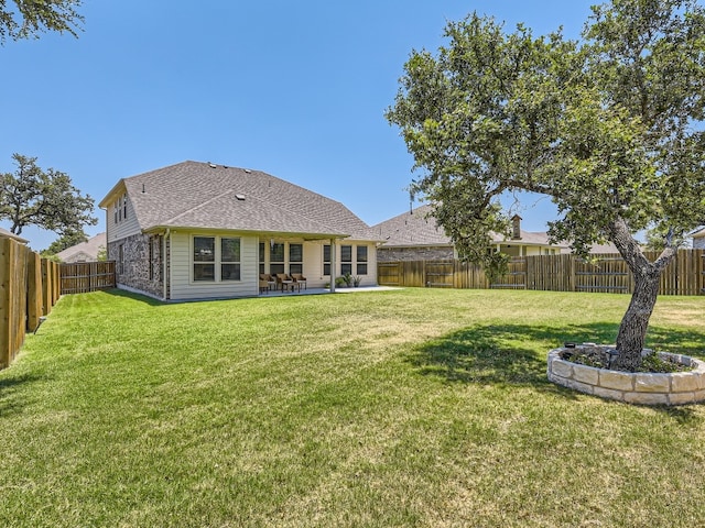 4325 Arques Ave, Round Rock, TX 78681 - back of property featuring a patio area and a shingled roof