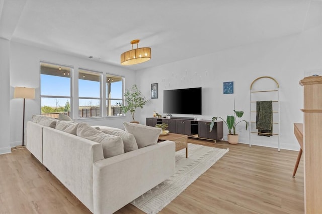 424 Turnbuckle Bnd, Leander, TX 78641 - living room with light wood-style floors and baseboards