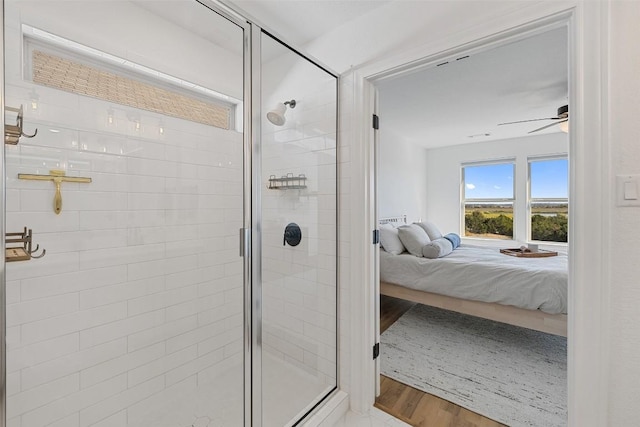 424 Turnbuckle Bnd, Leander, TX 78641 - bathroom featuring connected bathroom, a shower stall, and wood finished floors