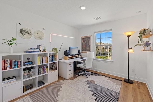 424 Turnbuckle Bnd, Leander, TX 78641 - home office featuring wood finished floors and baseboards