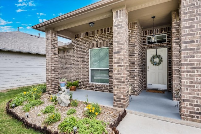 entrance to property with brick siding