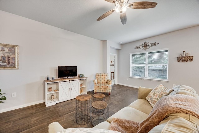 living room featuring ceiling fan, dark wood-type flooring, and baseboards