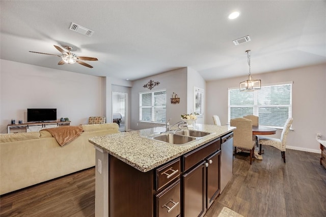 kitchen featuring a sink, stainless steel dishwasher, open floor plan, dark wood finished floors, and dark brown cabinets