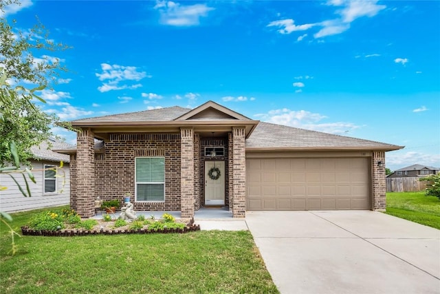 ranch-style house featuring a garage, a front yard, driveway, and brick siding
