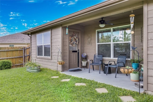 doorway to property featuring a ceiling fan