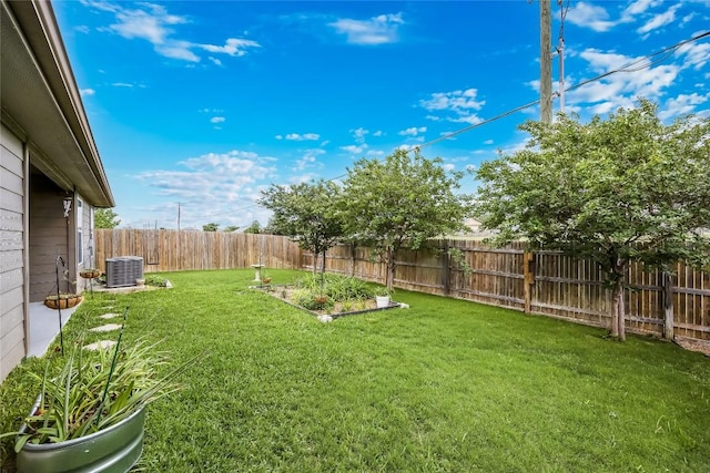 view of yard featuring central AC unit