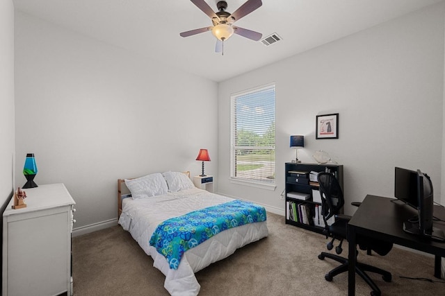 bedroom featuring carpet floors, baseboards, a desk, and ceiling fan