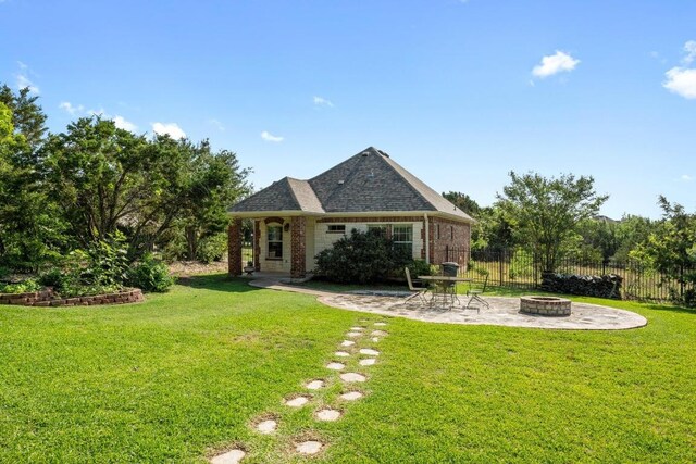117 Hucks Hideaway, Dripping Springs, TX 78620 - back of house with an outdoor fire pit, a patio area, and brick siding