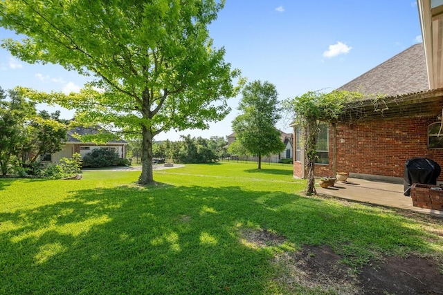 117 Hucks Hideaway, Dripping Springs, TX 78620 - view of grassy yard featuring a patio