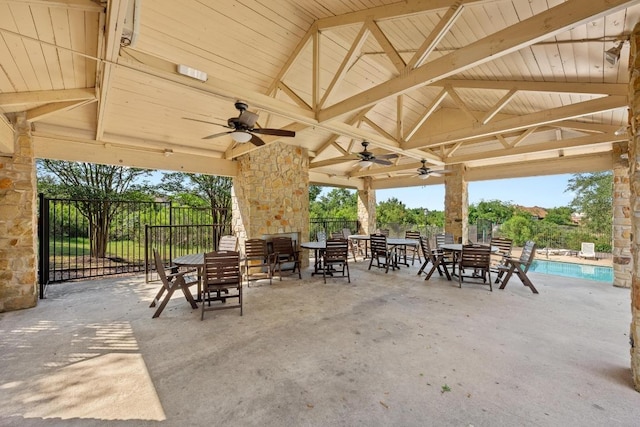 view of patio with fence, a ceiling fan, and a gazebo