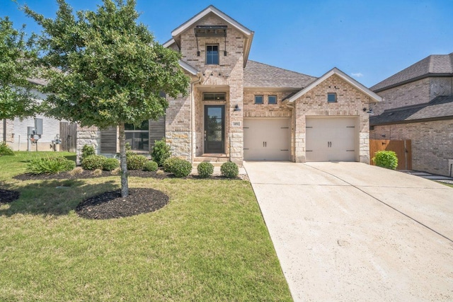 view of front of house with brick siding, concrete driveway, a garage, and stone siding