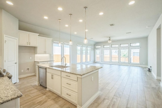 kitchen with dishwasher, a ceiling fan, plenty of natural light, light wood-style flooring, and recessed lighting