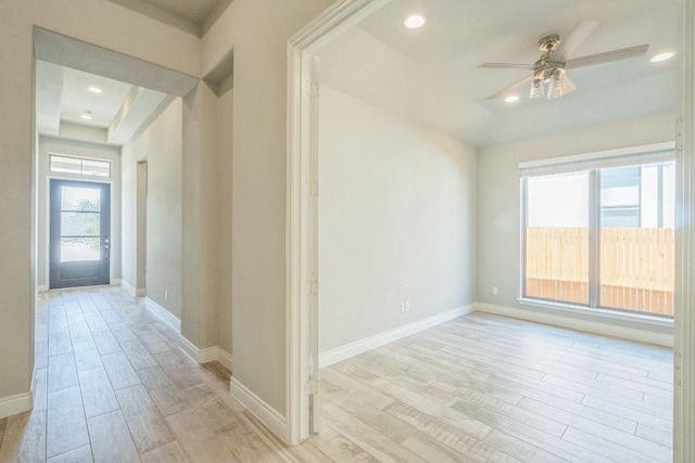 unfurnished room with light wood-style floors, ceiling fan, baseboards, and recessed lighting