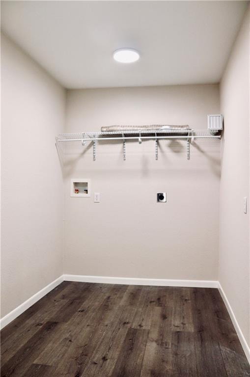 406 Rivers St, Smithville, TX 78957 - laundry room featuring hookup for an electric dryer, washer hookup, dark wood-style floors, and baseboards