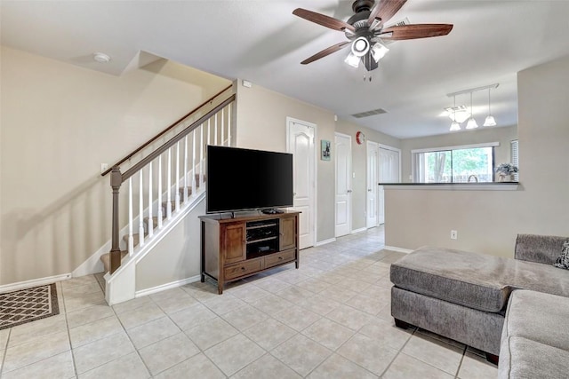 11901 Swearingen Dr Unit 110, Austin, TX 78758 - living room with stairs, light tile patterned flooring, and ceiling fan