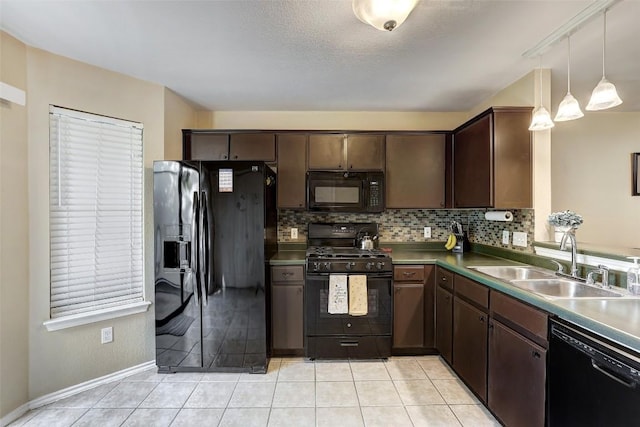 kitchen with black appliances, a sink, decorative backsplash, dark brown cabinets, and light tile patterned flooring