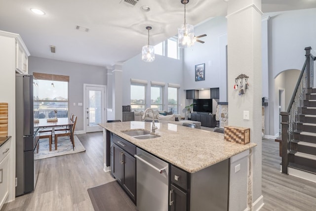 3405 Eagle Ridge Ln, Pflugerville, TX 78660 - kitchen featuring a sink, stainless steel appliances, ceiling fan, light wood-style floors, and recessed lighting