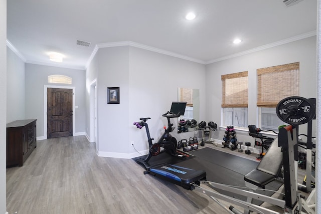 3405 Eagle Ridge Ln, Pflugerville, TX 78660 - workout room featuring wood finished floors, ornamental molding, baseboards, healthy amount of natural light, and recessed lighting