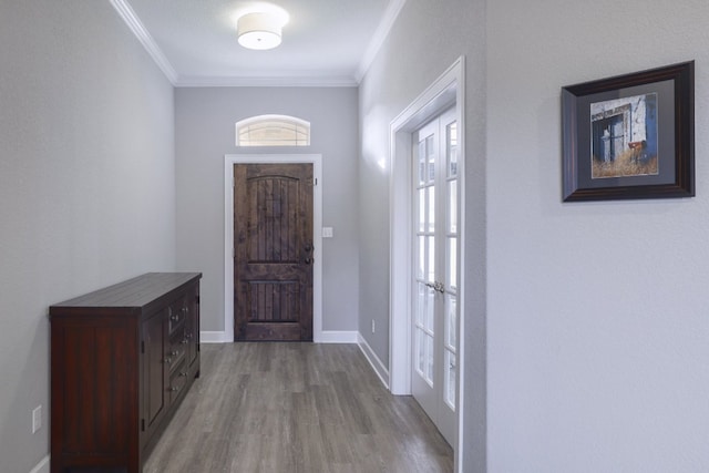 3405 Eagle Ridge Ln, Pflugerville, TX 78660 - foyer entrance featuring crown molding, wood finished floors, and baseboards