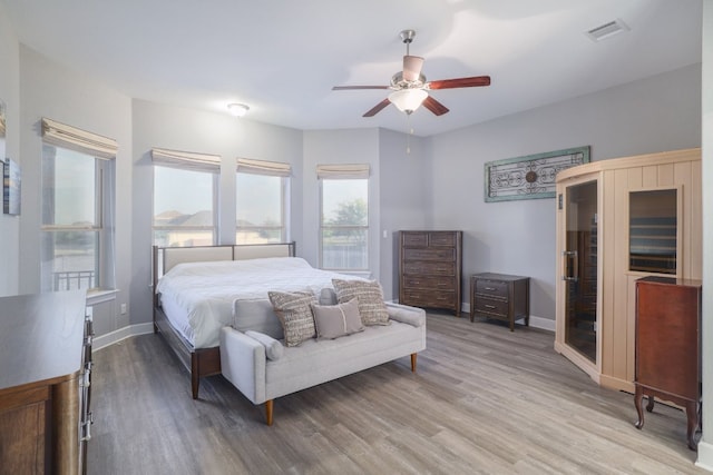 3405 Eagle Ridge Ln, Pflugerville, TX 78660 - bedroom with light wood finished floors, baseboards, and a ceiling fan
