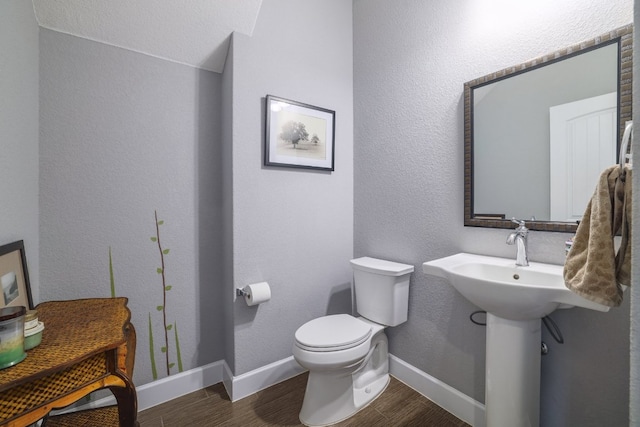 3405 Eagle Ridge Ln, Pflugerville, TX 78660 - half bath featuring wood finished floors, toilet, and baseboards