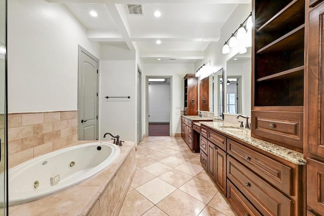 101 Blanco Ct, Horseshoe Bay, TX 78657 - full bath featuring beam ceiling, a whirlpool tub, double vanity, recessed lighting, and tile patterned flooring
