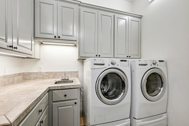 101 Blanco Ct, Horseshoe Bay, TX 78657 - laundry room with cabinet space and washer and clothes dryer
