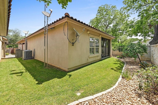 101 Blanco Ct, Horseshoe Bay, TX 78657 - view of side of home featuring central AC, stucco siding, and a tiled roof