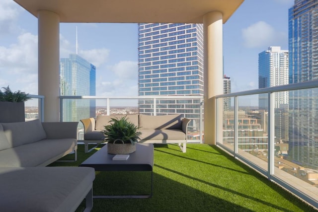 balcony featuring a view of city and outdoor lounge area