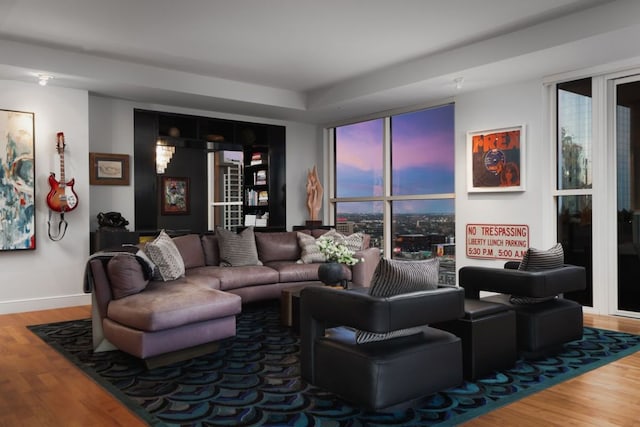 living room with wood finished floors and baseboards