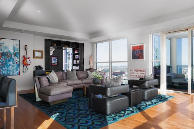 living room with wood finished floors and baseboards