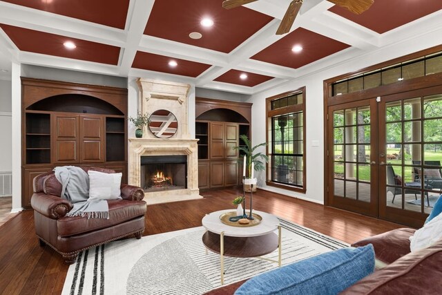 112 Oak Ct, Bastrop, TX 78602 - living room with french doors, coffered ceiling, ceiling fan, hardwood / wood-style floors, and a fireplace