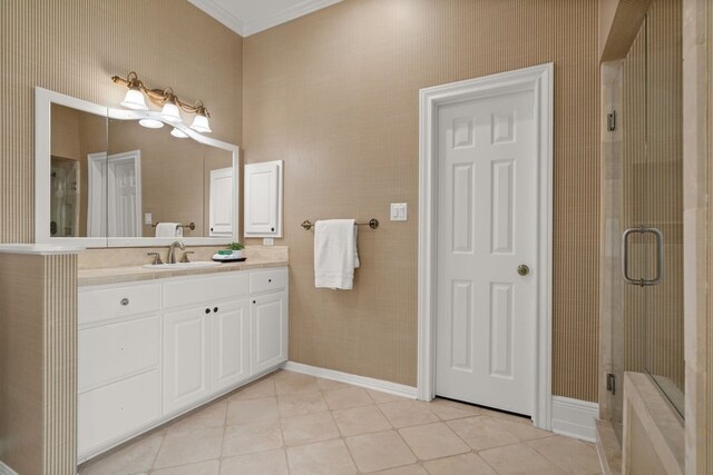 112 Oak Ct, Bastrop, TX 78602 - full bathroom featuring tile patterned floors, a shower stall, vanity, ornamental molding, and baseboards
