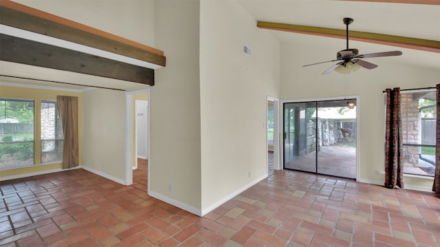 spare room with baseboards, a ceiling fan, beam ceiling, and high vaulted ceiling