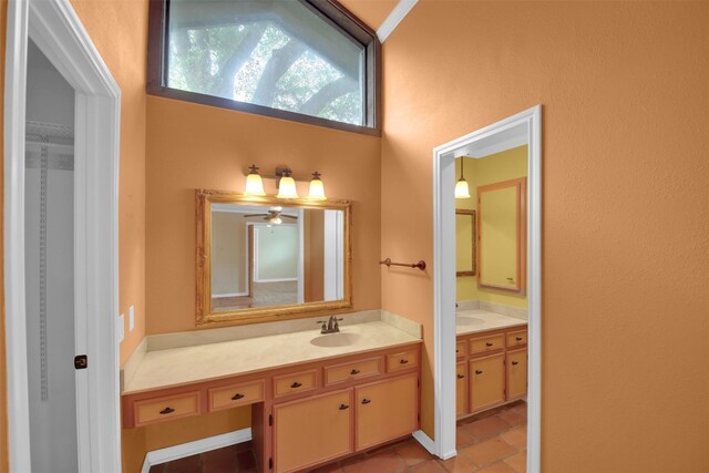 bathroom featuring vanity, a ceiling fan, and tile patterned flooring