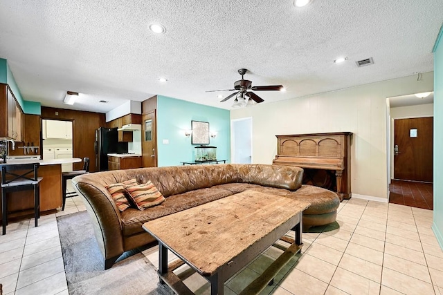 3305 Carol Ann Dr, Austin, TX 78723 - living area featuring light tile patterned floors, a ceiling fan, a textured ceiling, recessed lighting, and baseboards