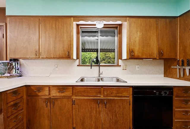 3305 Carol Ann Dr, Austin, TX 78723 - kitchen with black dishwasher, a sink, light countertops, and decorative backsplash