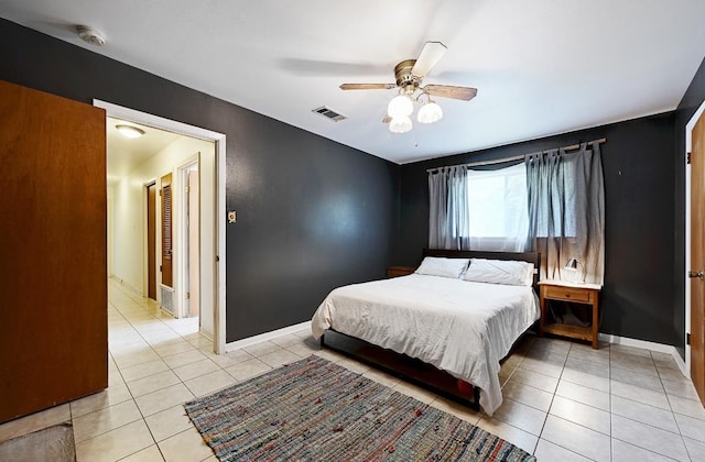 3305 Carol Ann Dr, Austin, TX 78723 - bedroom featuring light tile patterned floors, baseboards, and ceiling fan