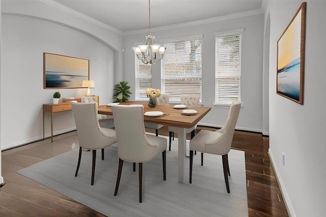 109 Lake Livingston Dr, Georgetown, TX 78628 - dining room featuring a chandelier, crown molding, wood finished floors, and a baseboard heating unit