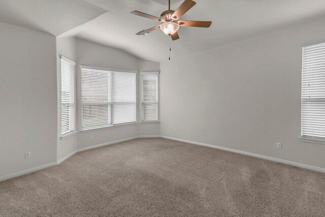 109 Lake Livingston Dr, Georgetown, TX 78628 - empty room featuring carpet flooring, a ceiling fan, healthy amount of natural light, and vaulted ceiling