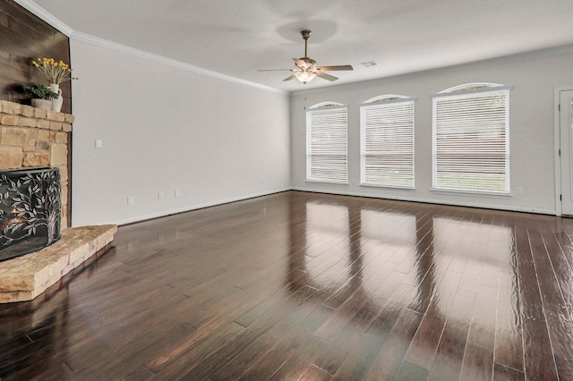 109 Lake Livingston Dr, Georgetown, TX 78628 - unfurnished living room featuring a ceiling fan, ornamental molding, wood finished floors, and a fireplace