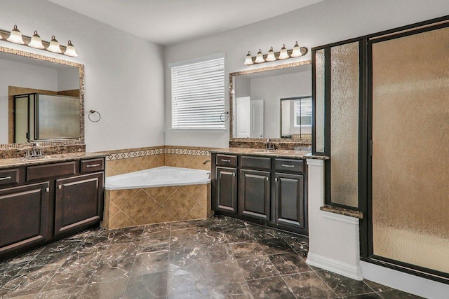 109 Lake Livingston Dr, Georgetown, TX 78628 - full bathroom featuring a stall shower, plenty of natural light, two vanities, and a bath