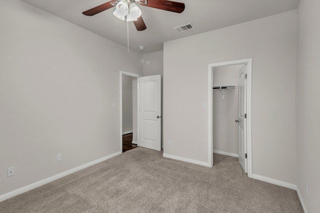 109 Lake Livingston Dr, Georgetown, TX 78628 - unfurnished bedroom with carpet flooring, a walk in closet, a ceiling fan, and a closet