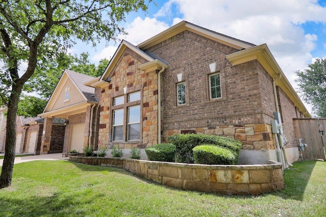 109 Lake Livingston Dr, Georgetown, TX 78628 - view of front of property with stone siding, a garage, and brick siding