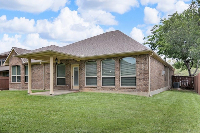 109 Lake Livingston Dr, Georgetown, TX 78628 - back of property with brick siding, a fenced backyard, a patio, and a shingled roof