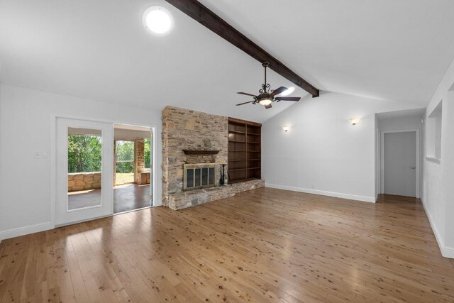 8006 Red Willow Dr, Austin, TX 78736 - unfurnished living room featuring wood-type flooring, ceiling fan, a fireplace, and built in features